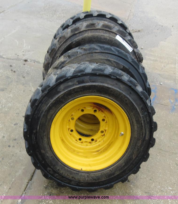 image for item AO9118 (4) John Deere skid steer tires and wheels