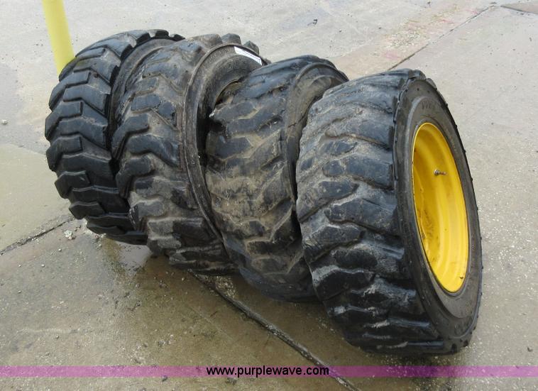 image for item AO9118 (4) John Deere skid steer tires and wheels