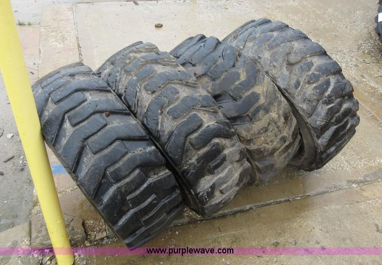 image for item AO9118 (4) John Deere skid steer tires and wheels