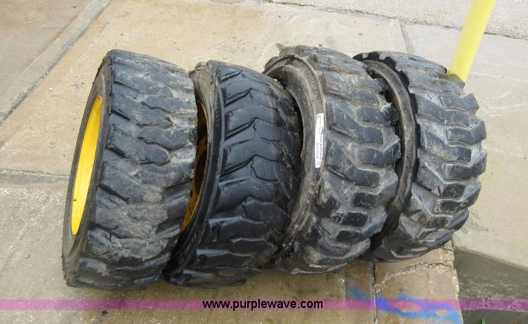 image for item AO9118 (4) John Deere skid steer tires and wheels