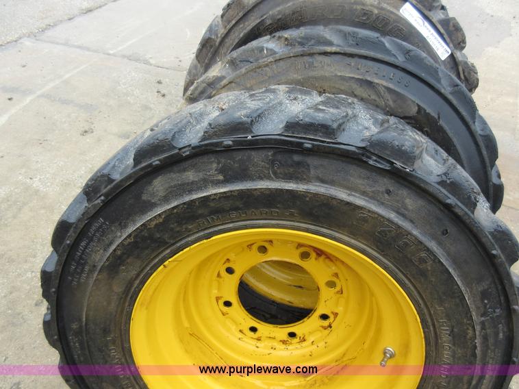 image for item AO9118 (4) John Deere skid steer tires and wheels