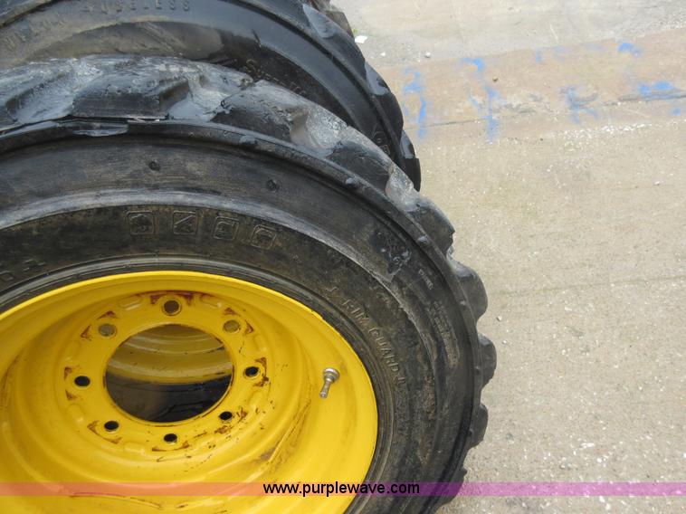 image for item AO9118 (4) John Deere skid steer tires and wheels