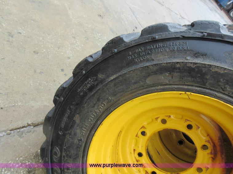 image for item AO9118 (4) John Deere skid steer tires and wheels