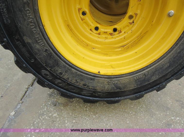 image for item AO9118 (4) John Deere skid steer tires and wheels