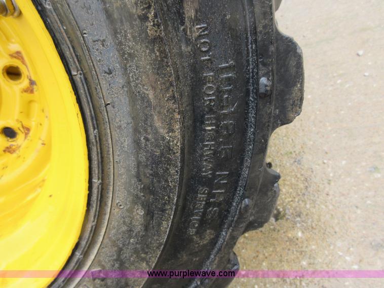 image for item AO9118 (4) John Deere skid steer tires and wheels