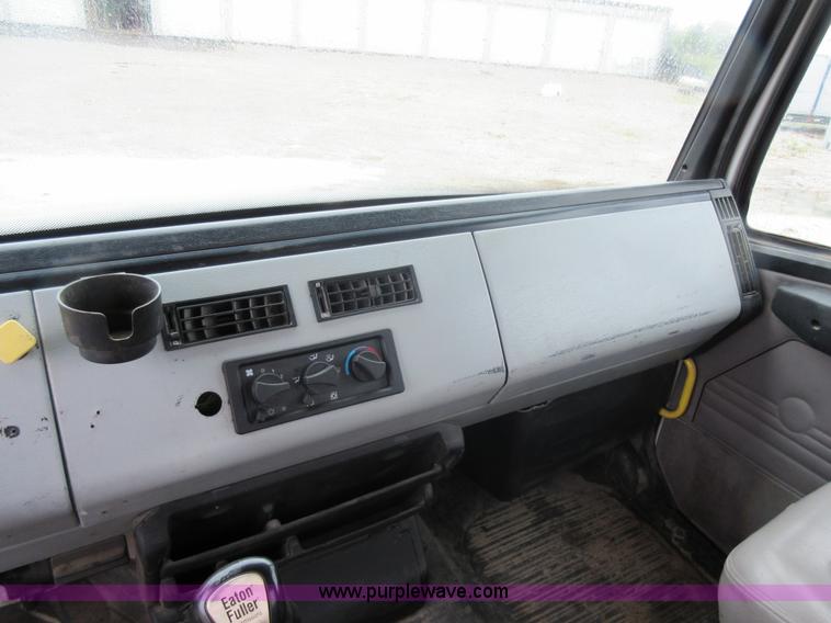 image for item AO9124 2003 Freightliner FL80 roll back truck