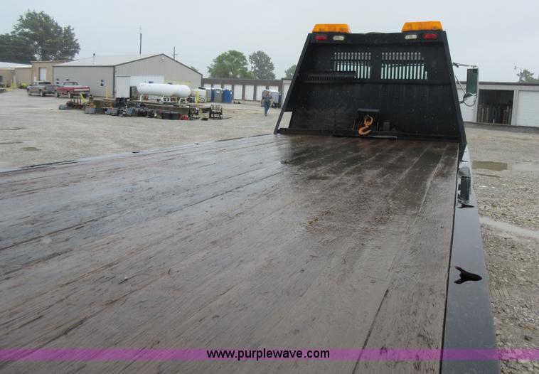 image for item AO9124 2003 Freightliner FL80 roll back truck