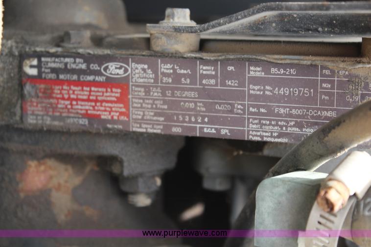 image for item BO9375 1994 Ford F700 rollback truck