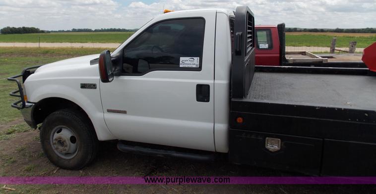 image for item J2748 2003 Ford F350 Super Duty XLT bale bed pickup truck