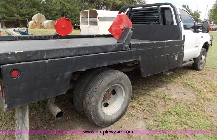 image for item J2748 2003 Ford F350 Super Duty XLT bale bed pickup truck