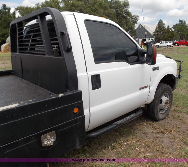 image for item J2748 2003 Ford F350 Super Duty XLT bale bed pickup truck