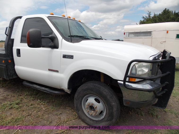 image for item J2748 2003 Ford F350 Super Duty XLT bale bed pickup truck