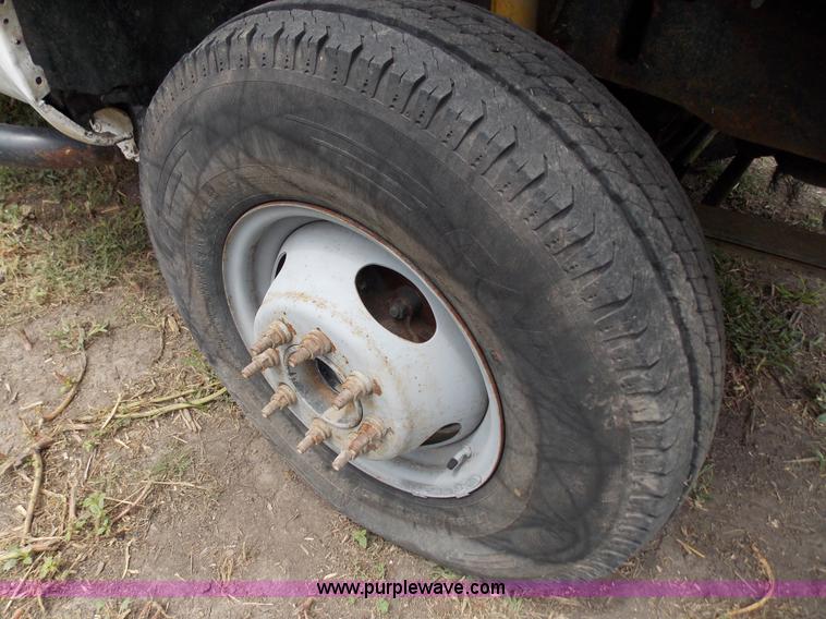 image for item J2748 2003 Ford F350 Super Duty XLT bale bed pickup truck