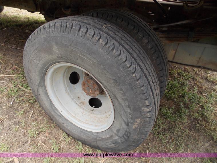 image for item J2748 2003 Ford F350 Super Duty XLT bale bed pickup truck