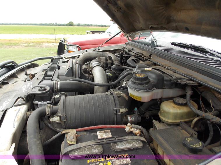 image for item J2748 2003 Ford F350 Super Duty XLT bale bed pickup truck