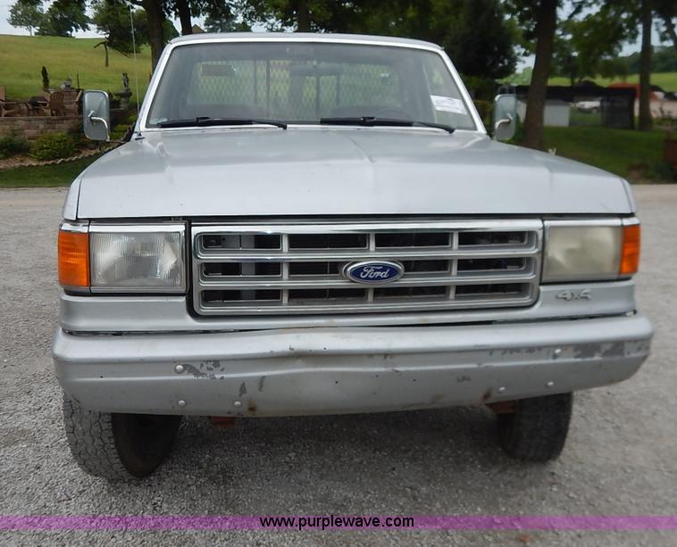 image for item K1538 1988 Ford F250 XLT Lariat flatbed pickup truck