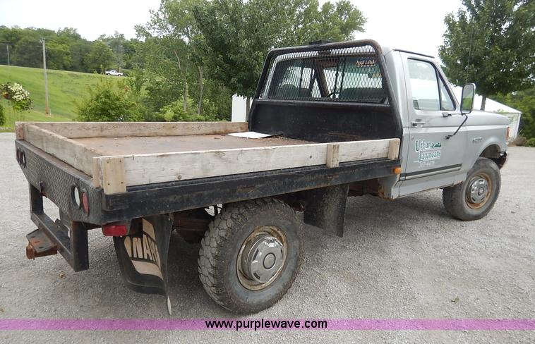 image for item K1538 1988 Ford F250 XLT Lariat flatbed pickup truck