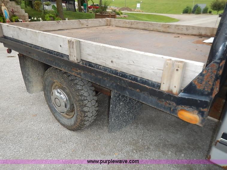 image for item K1538 1988 Ford F250 XLT Lariat flatbed pickup truck