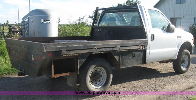 image for item K8719 2000 Ford F250 Super Duty XL flatbed pickup truck