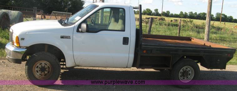 image for item K8719 2000 Ford F250 Super Duty XL flatbed pickup truck