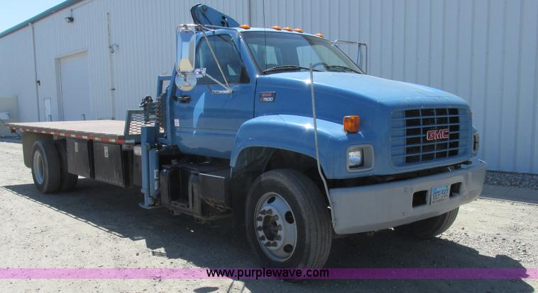 image for item A8848 1999 GMC C7500 flatbed truck with crane