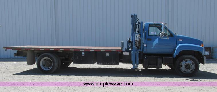 image for item A8848 1999 GMC C7500 flatbed truck with crane