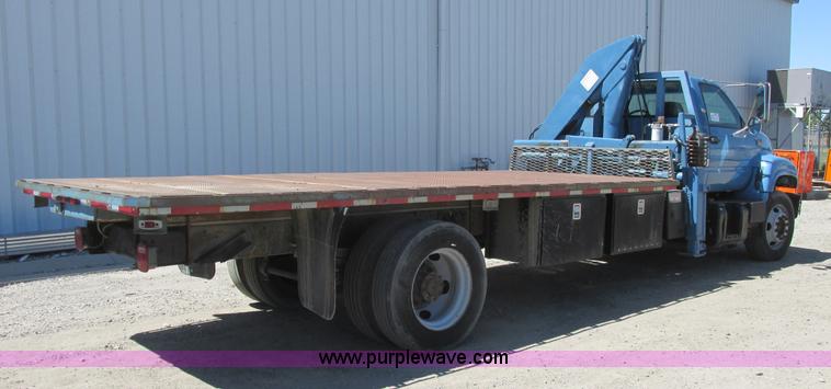 image for item A8848 1999 GMC C7500 flatbed truck with crane