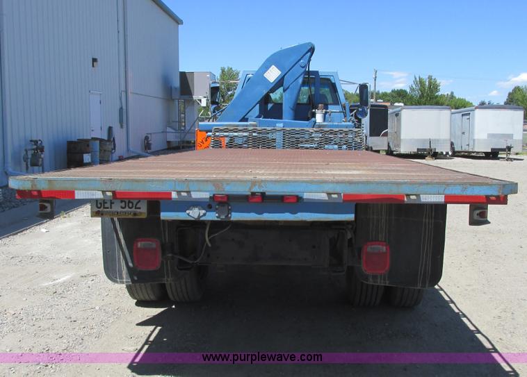 image for item A8848 1999 GMC C7500 flatbed truck with crane