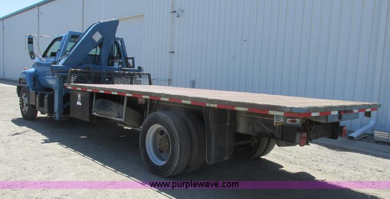 image for item A8848 1999 GMC C7500 flatbed truck with crane