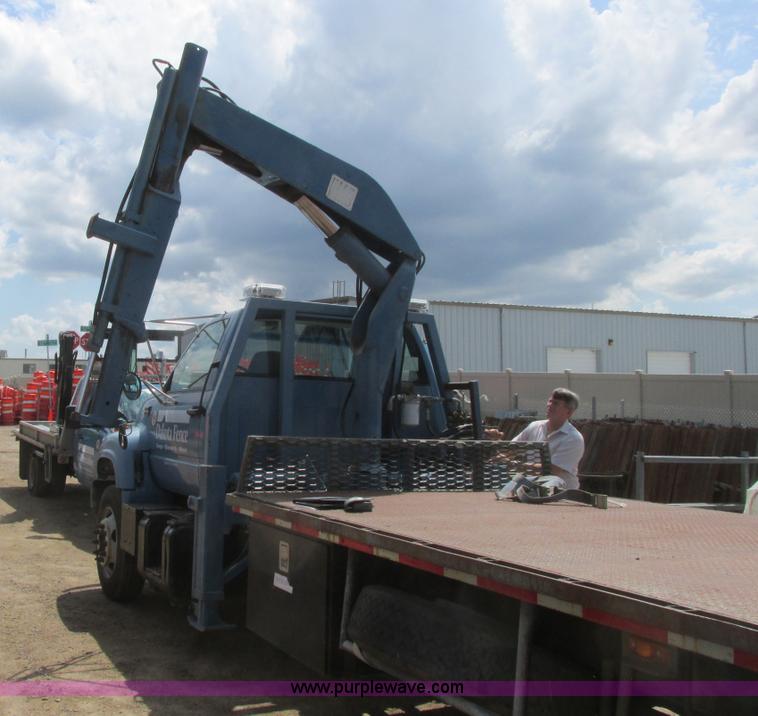 image for item A8848 1999 GMC C7500 flatbed truck with crane