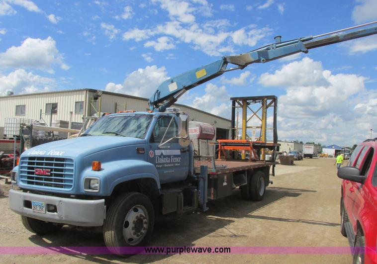 image for item A8848 1999 GMC C7500 flatbed truck with crane