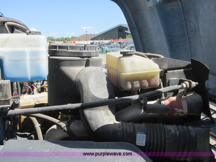 image for item A8848 1999 GMC C7500 flatbed truck with crane