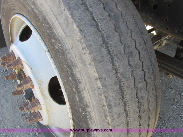 image for item A8848 1999 GMC C7500 flatbed truck with crane