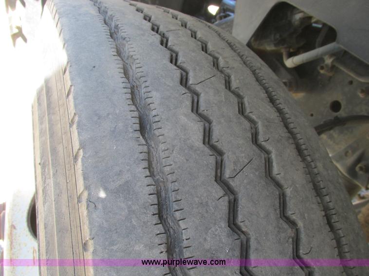 image for item A8848 1999 GMC C7500 flatbed truck with crane