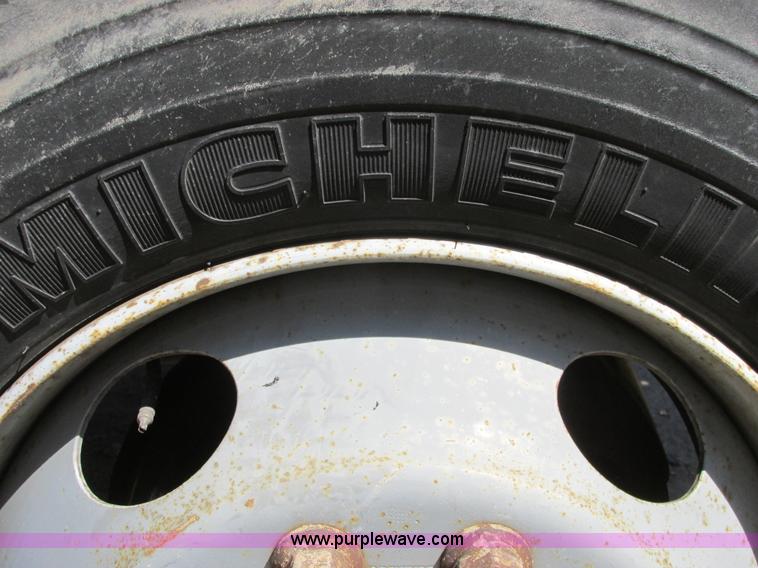 image for item A8848 1999 GMC C7500 flatbed truck with crane