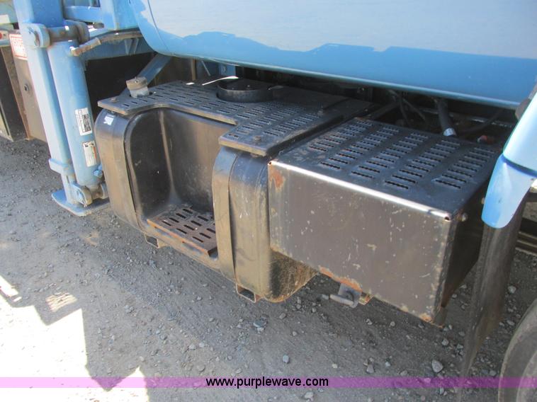 image for item A8848 1999 GMC C7500 flatbed truck with crane