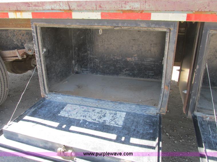 image for item A8848 1999 GMC C7500 flatbed truck with crane