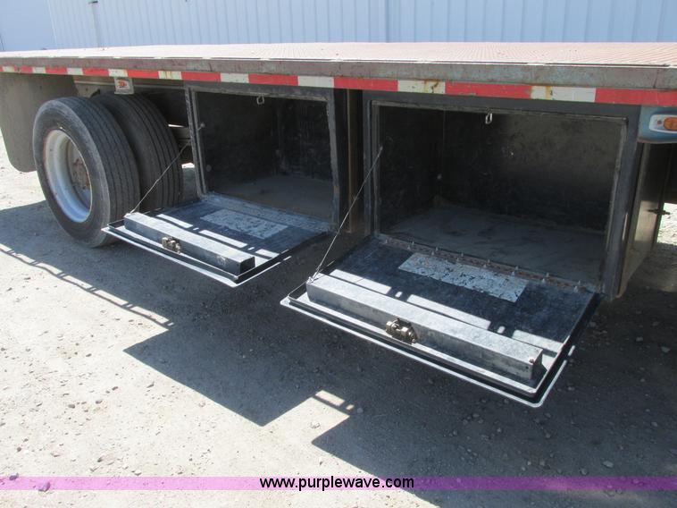 image for item A8848 1999 GMC C7500 flatbed truck with crane