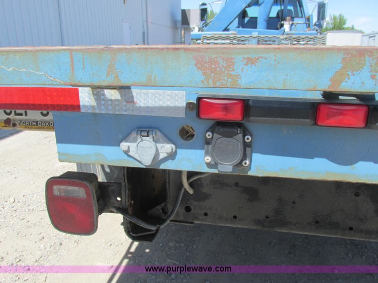 image for item A8848 1999 GMC C7500 flatbed truck with crane