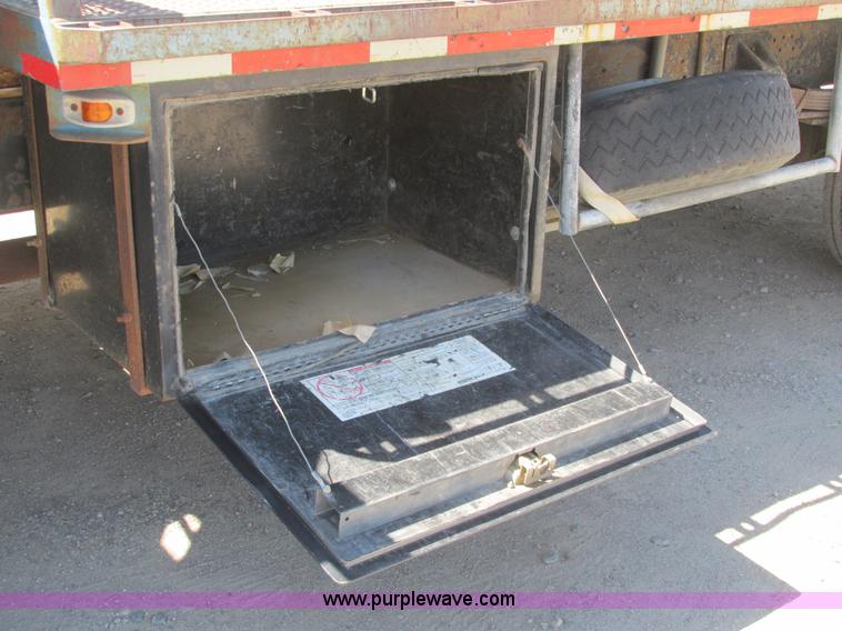 image for item A8848 1999 GMC C7500 flatbed truck with crane