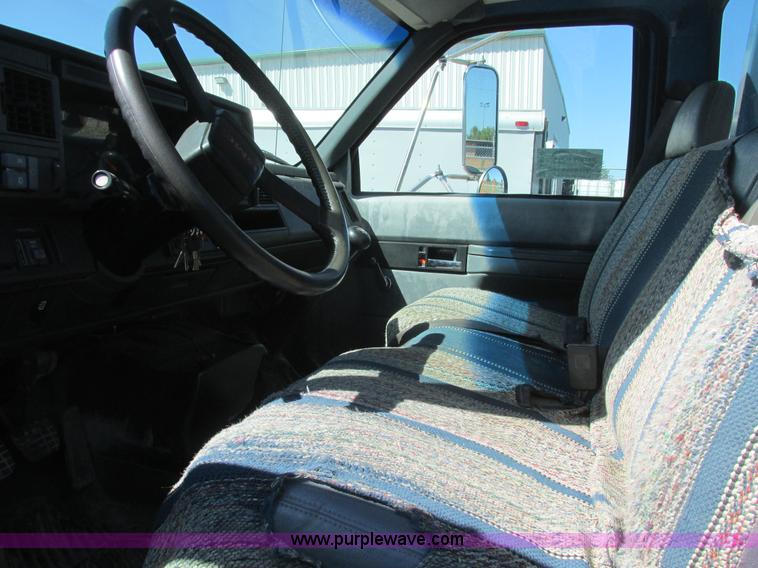 image for item A8848 1999 GMC C7500 flatbed truck with crane