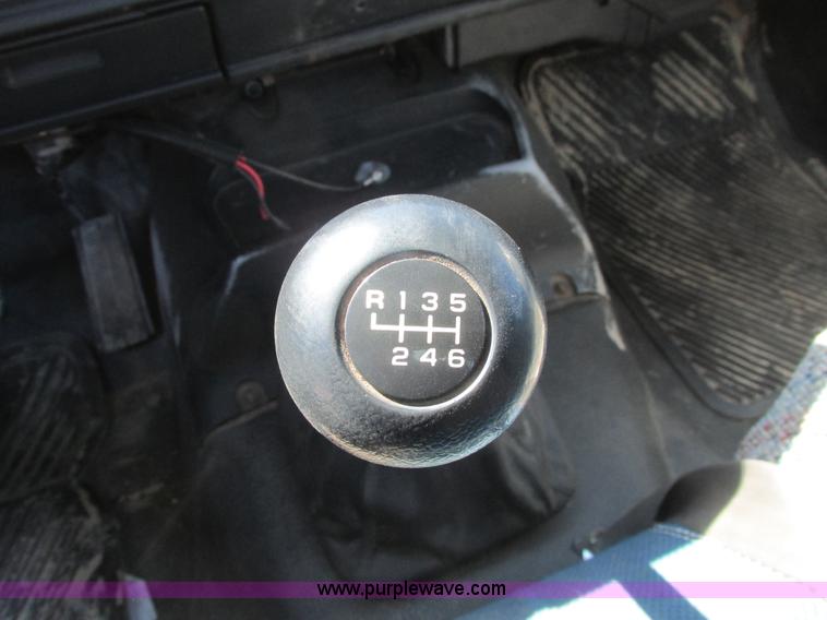 image for item A8848 1999 GMC C7500 flatbed truck with crane