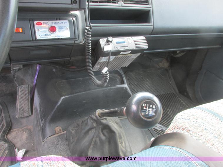 image for item A8848 1999 GMC C7500 flatbed truck with crane