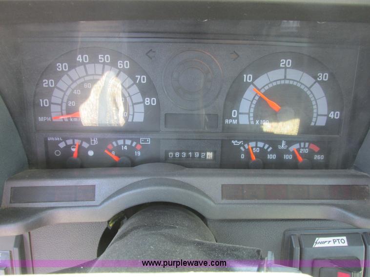 image for item A8848 1999 GMC C7500 flatbed truck with crane