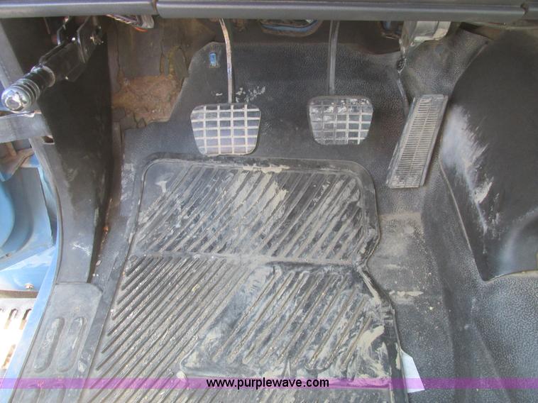 image for item A8848 1999 GMC C7500 flatbed truck with crane