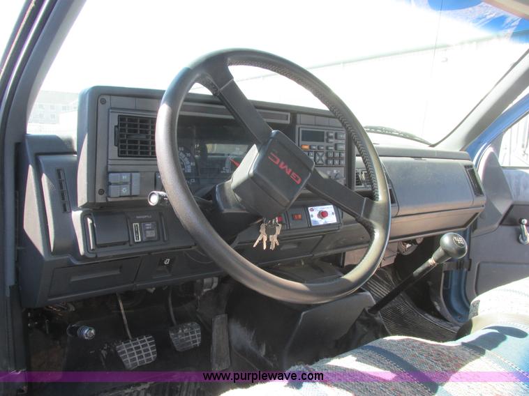 image for item A8848 1999 GMC C7500 flatbed truck with crane