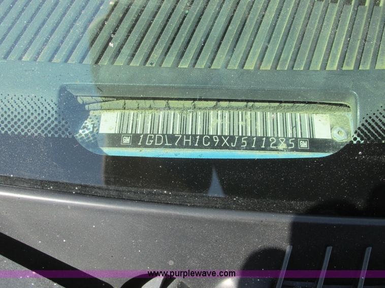 image for item A8848 1999 GMC C7500 flatbed truck with crane