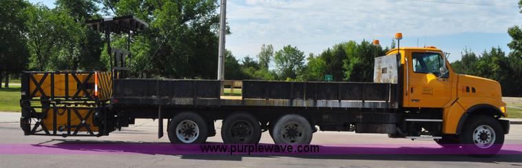 image for item F2498 2003 Sterling LT9500 flatbed truck