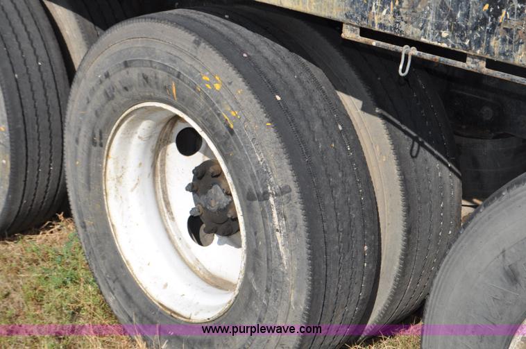 image for item F2498 2003 Sterling LT9500 flatbed truck