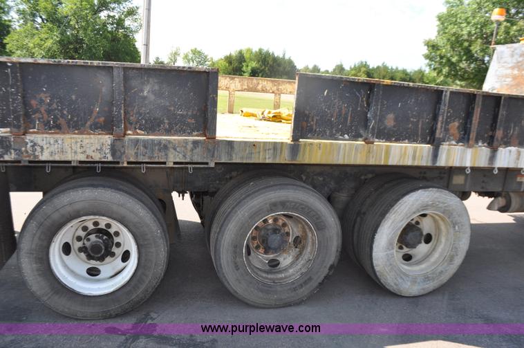 image for item F2498 2003 Sterling LT9500 flatbed truck